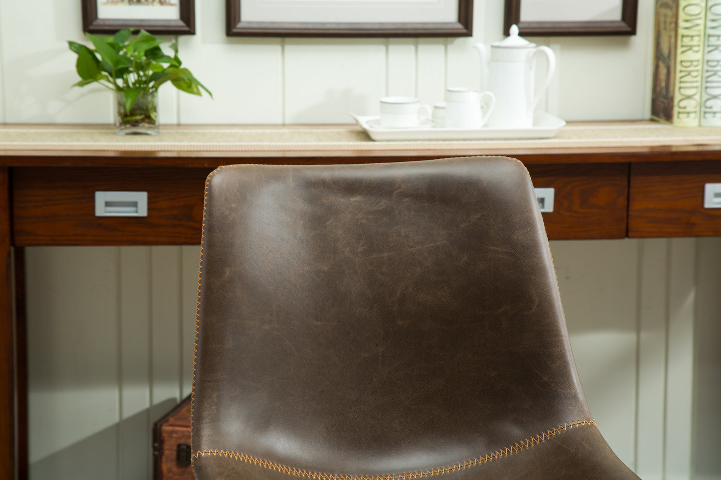 Brown distressed leather accent chair with visible stitching