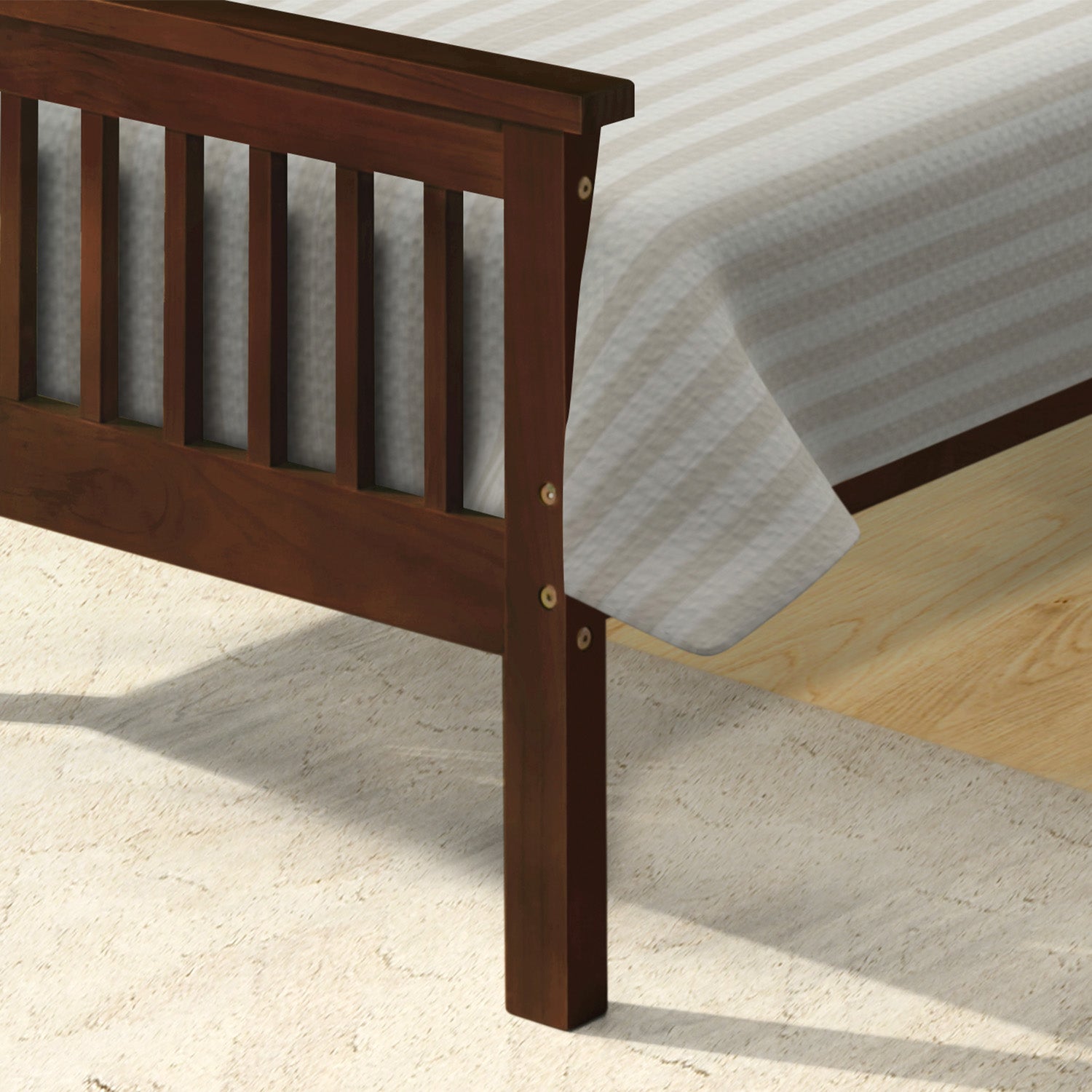 Dark brown wood slatted headboard of a bed frame