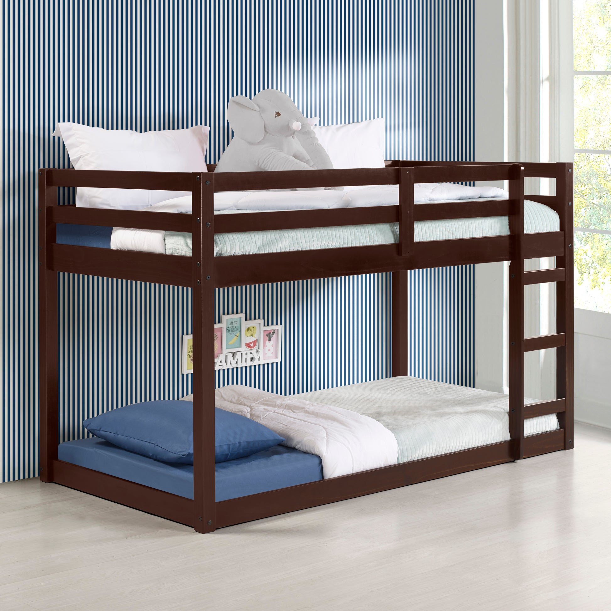 Dark brown solid wood bunk bed with white and blue striped wallpaper background