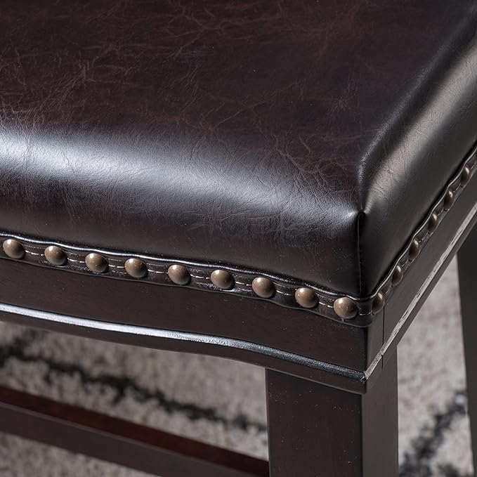 Dark brown faux leather counter stool with brass nailhead trim