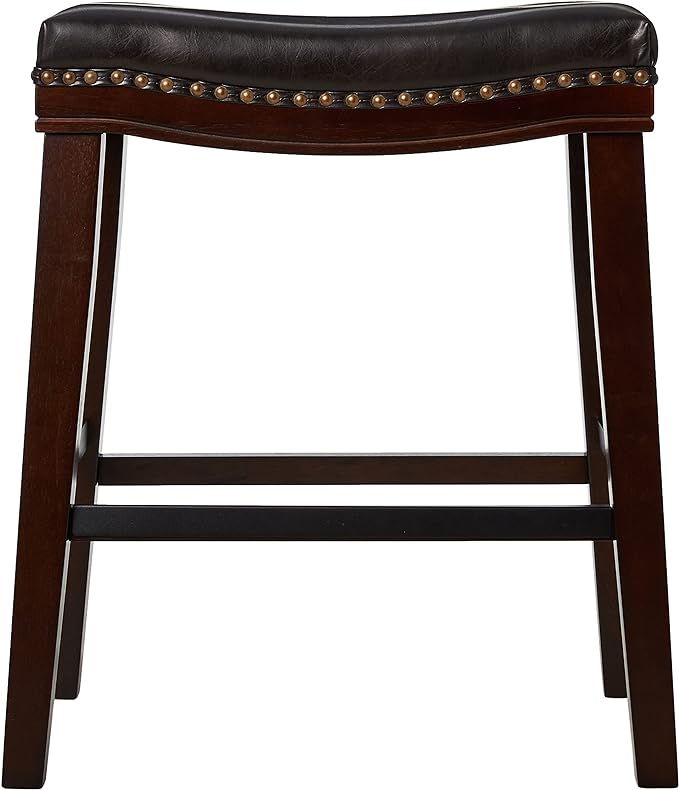 Dark brown faux leather saddle stool with bronze nailhead trim and mahogany finish legs