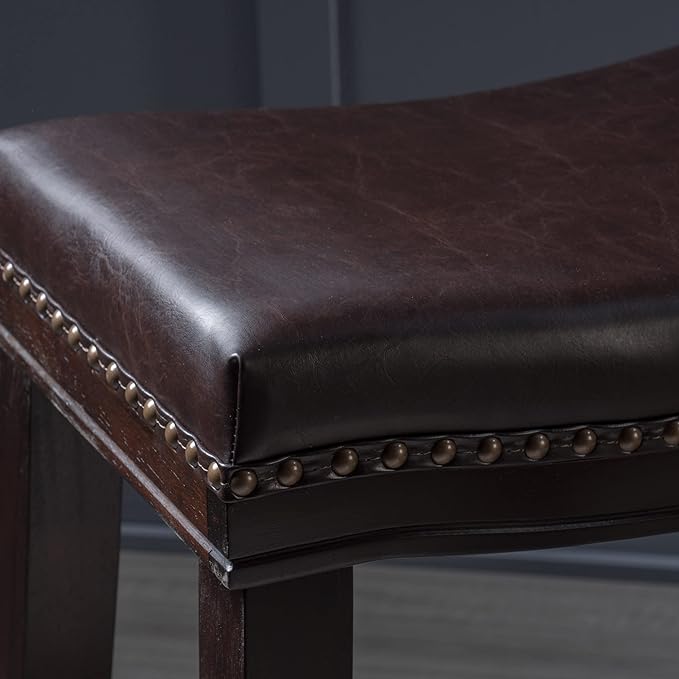 Dark brown faux leather counter stool with antique nailhead trim