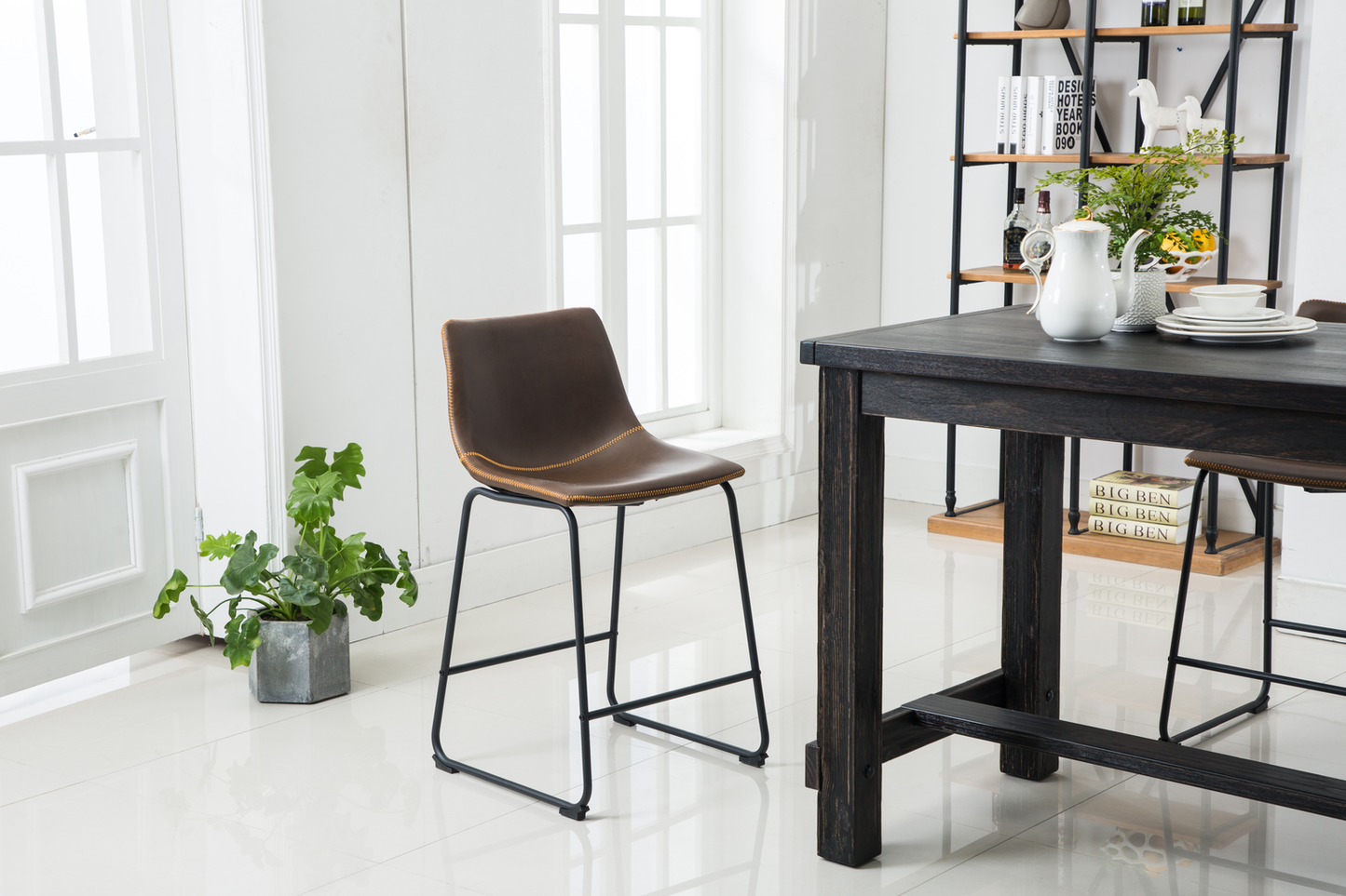 Brown faux leather counter stool with black metal legs and stitching