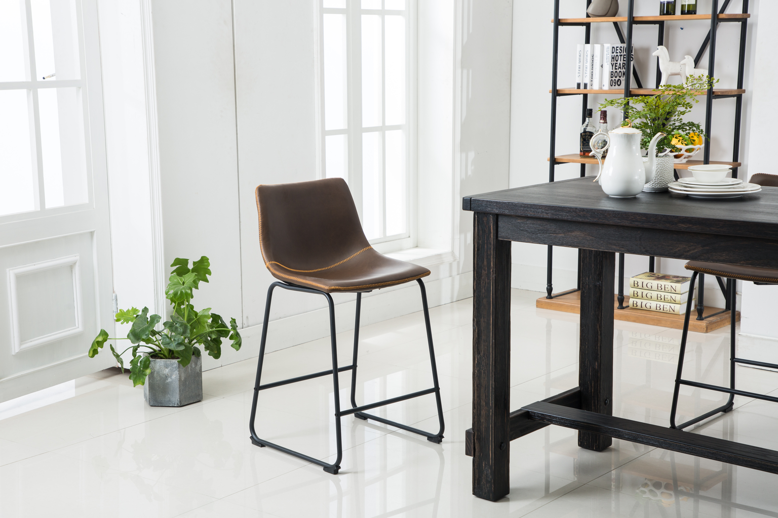 Brown faux leather counter stool with black metal legs and stitching