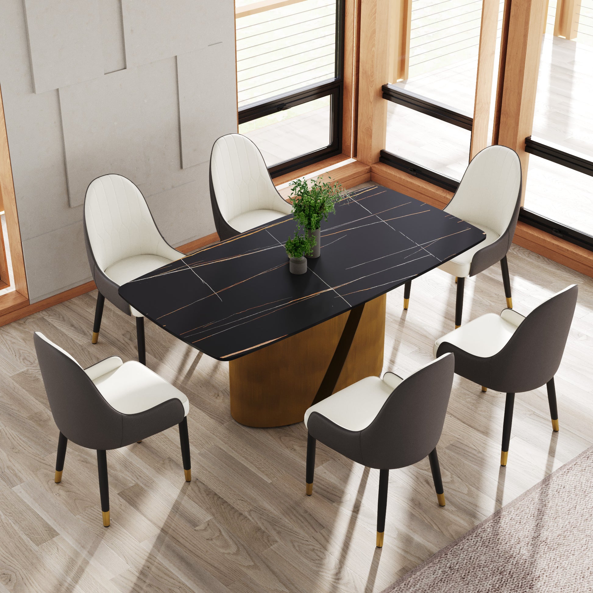 Modern black marble dining table with gold accents and whitegray chairs