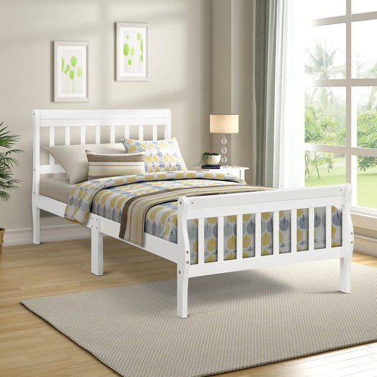 White wooden toddler bed with playful yellow leaf bedding