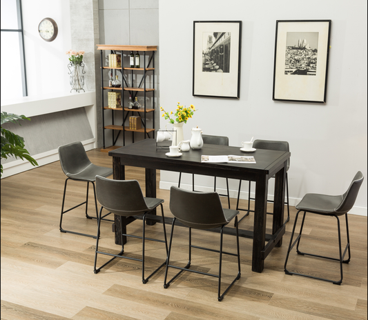 Dark wood counter height table with minimalist gray stools and stitched details