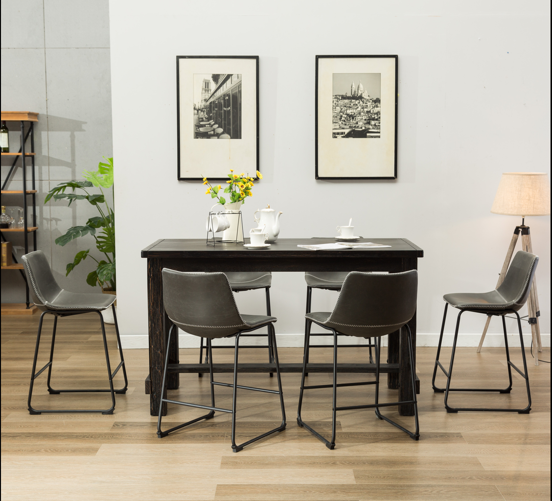 Dark gray faux leather counter stool with white stitching and metal legs