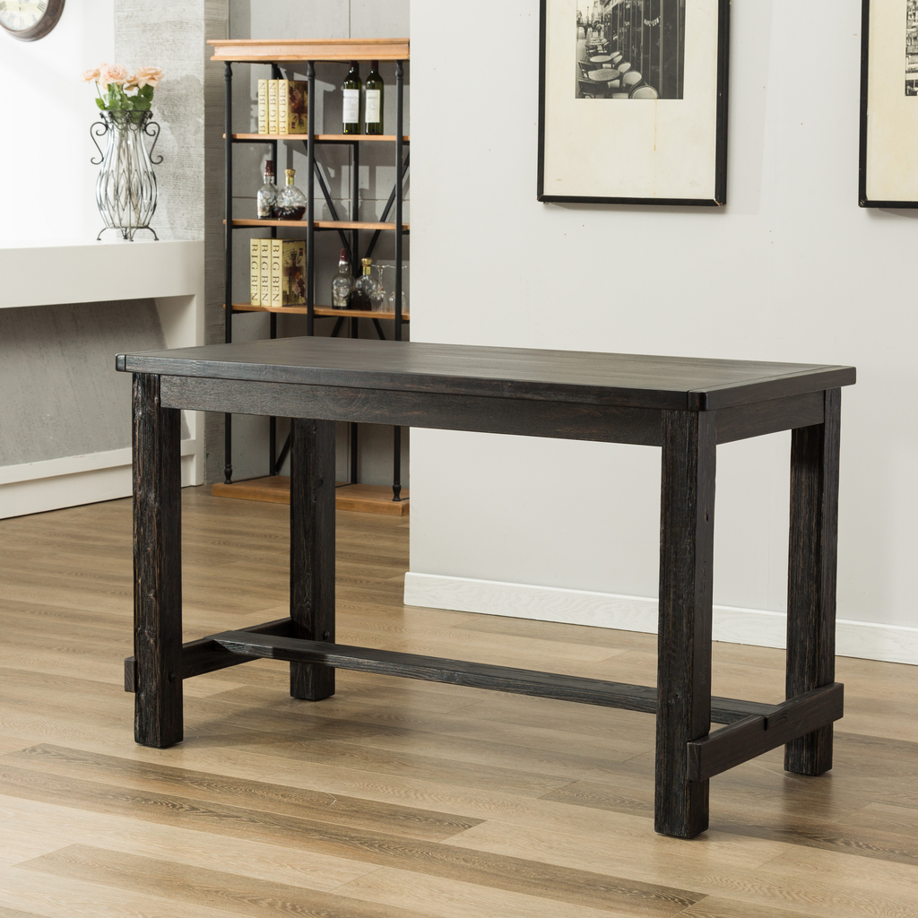 Dark wood counter height table with sturdy legs and footrest