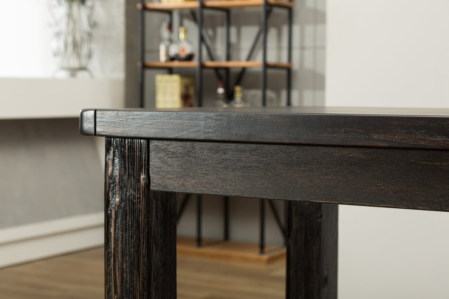 Dark oak dining table with rustic texture perfect for a farmhouse kitchen setting