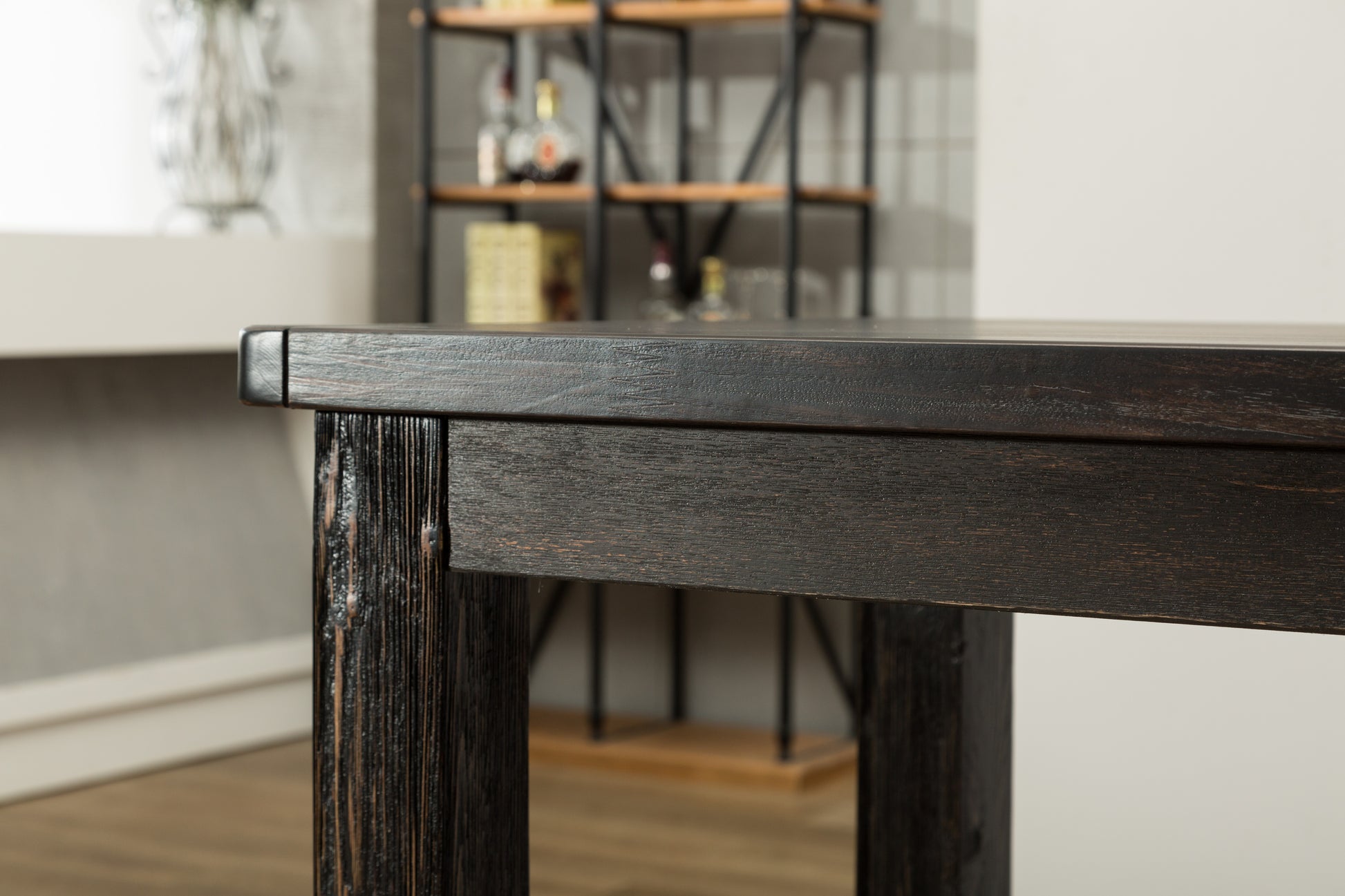 Dark oak dining table with rustic texture perfect for a farmhouse kitchen setting