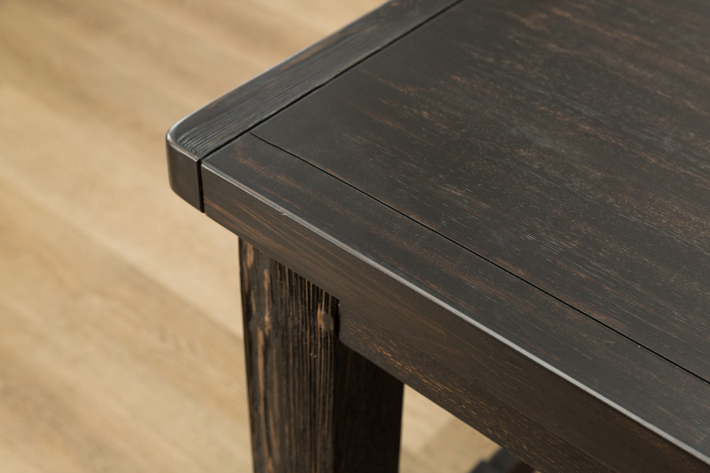 Dark brown reclaimed wood coffee table detail with visible grain