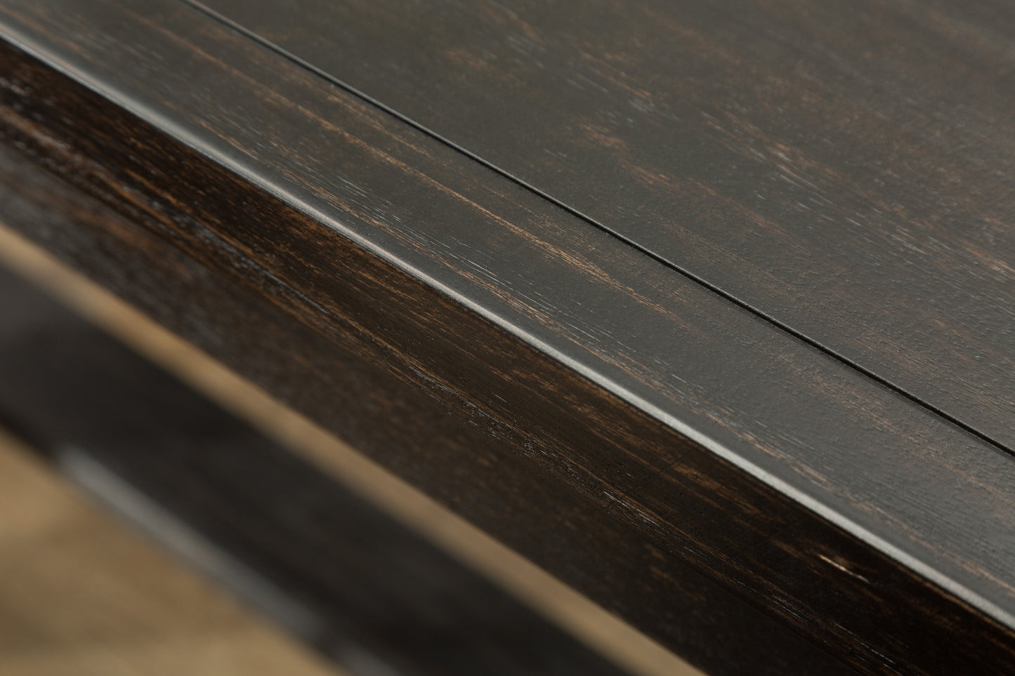 Dark wood table surface with textured grain