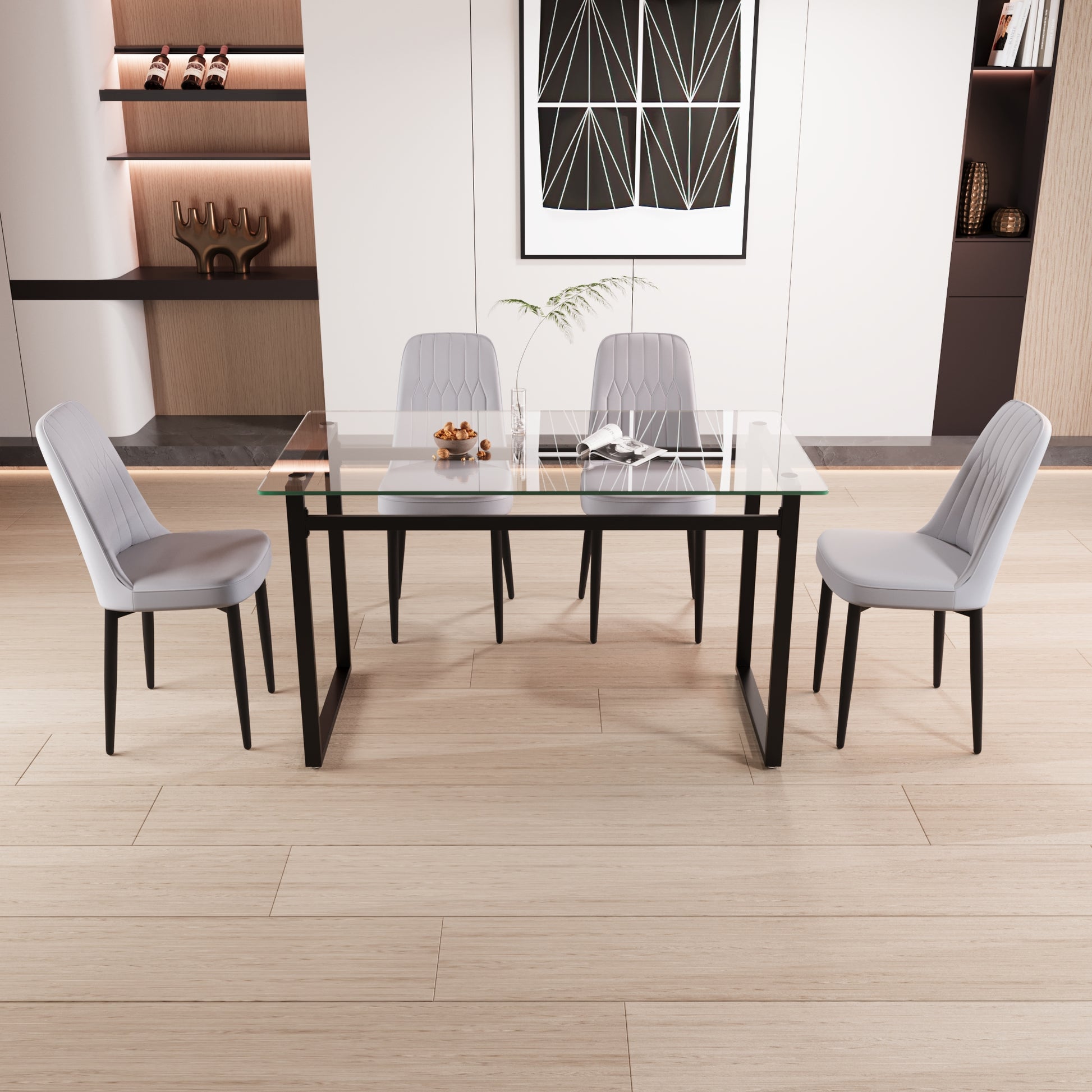 Modern glass top dining table with black metal legs and four light grey chairs