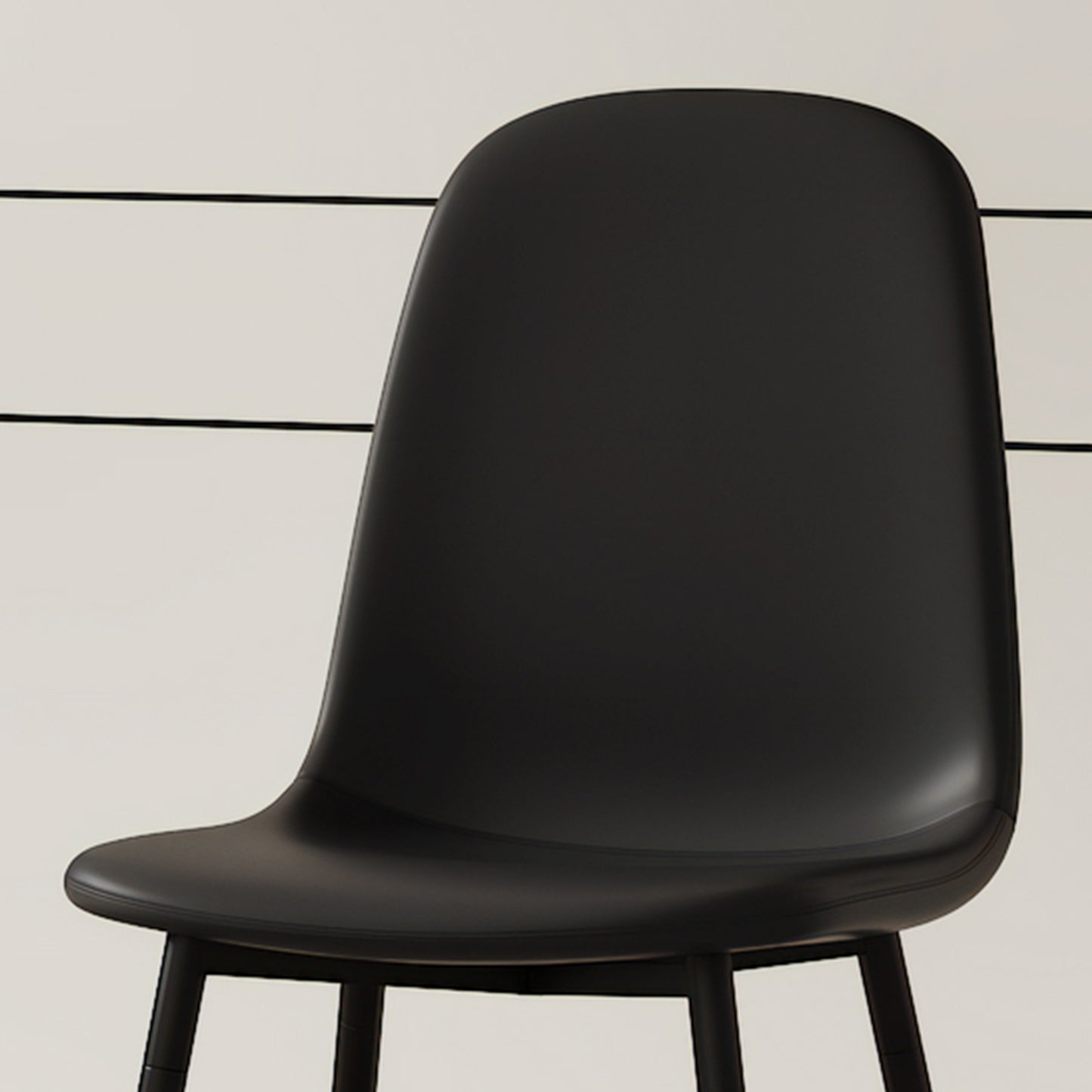 Black molded dining chair with curved back and wooden legs