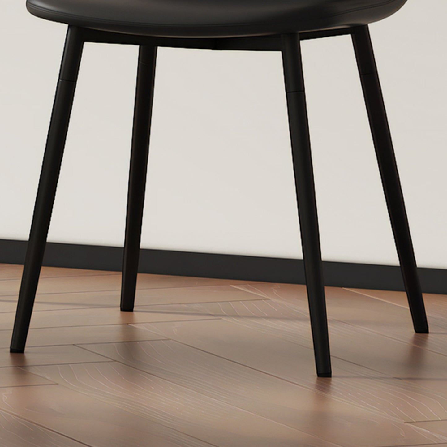 Black leather dining chair with slender matte black legs