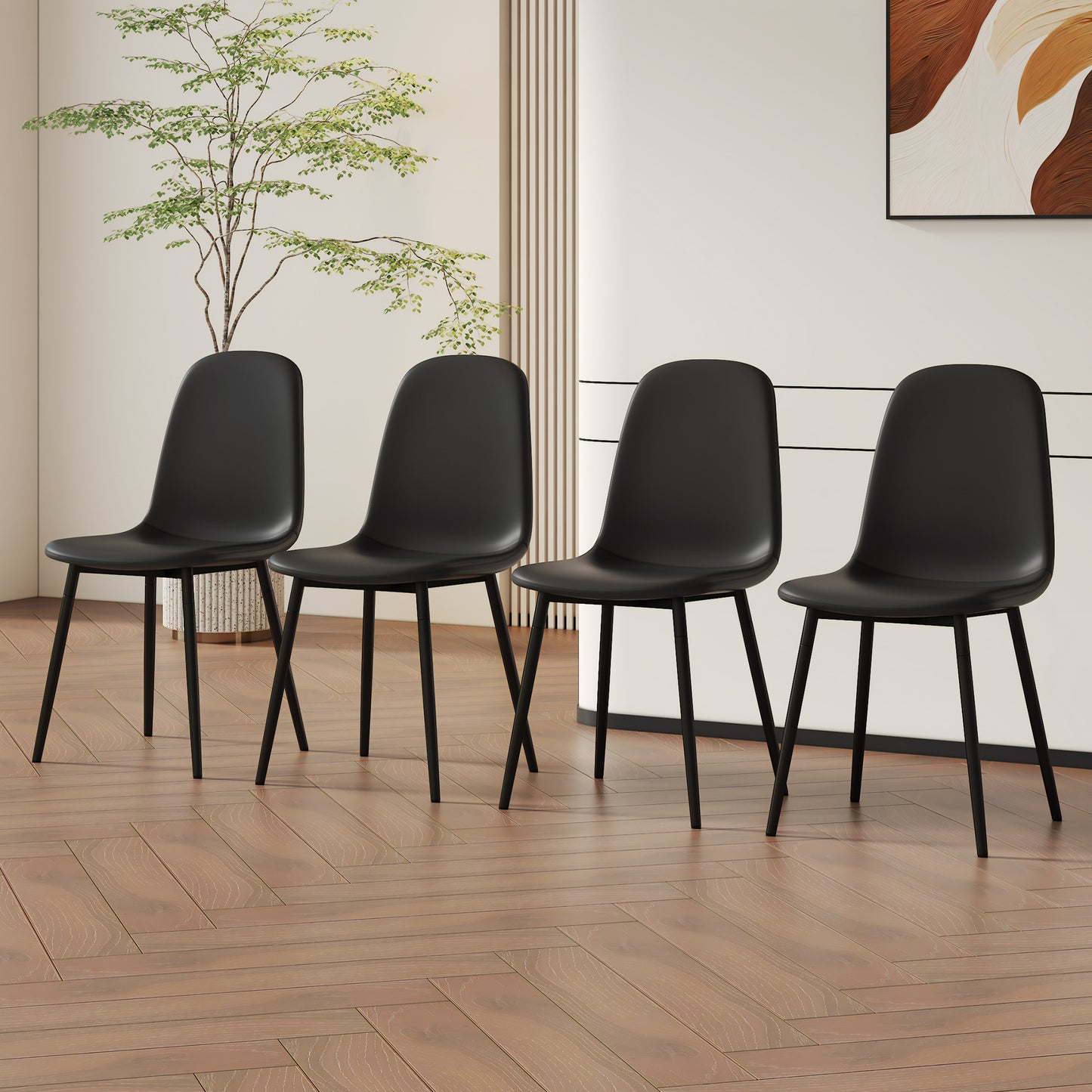Four black molded dining chairs with sleek black metal legs
