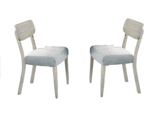 Two light grey upholstered dining chairs with natural wood legs