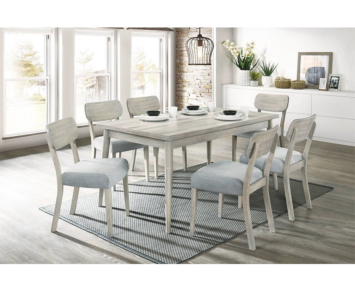 Light grey wood dining table with six upholstered chairs