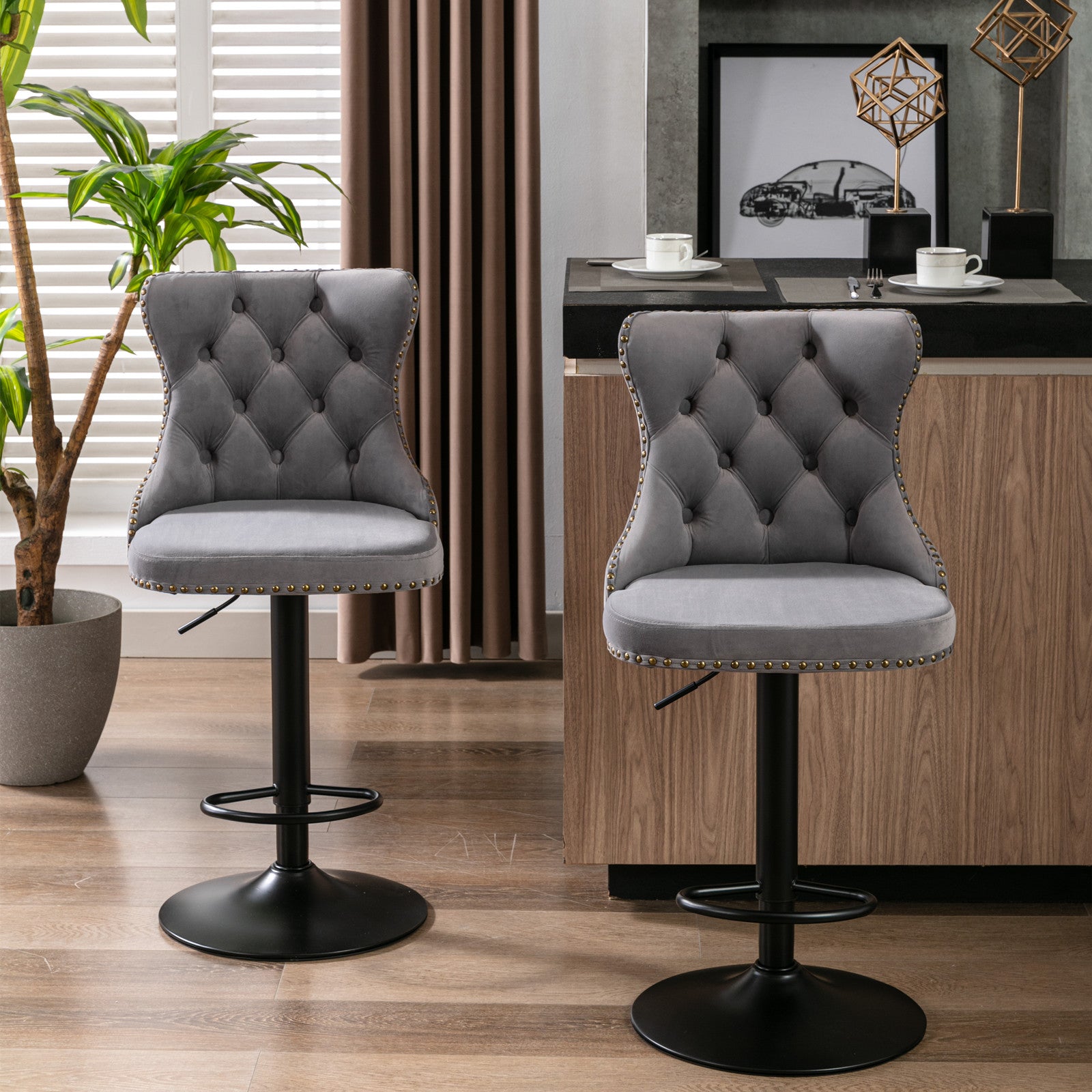Grey velvet tufted bar stool with gold nailhead trim and adjustable height