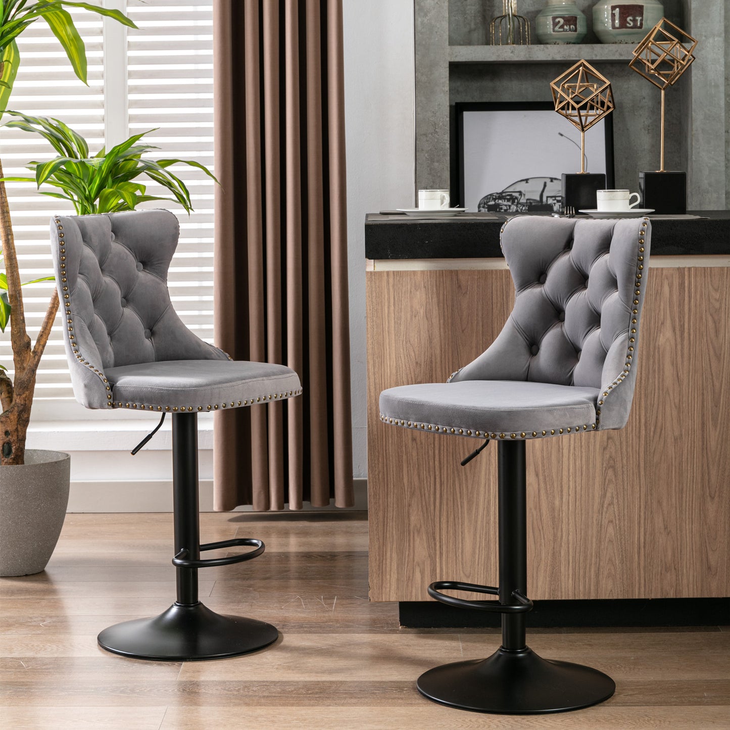 Gray velvet tufted bar stool with brass nailhead trim and black base