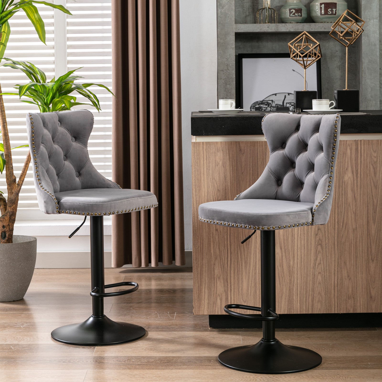 Gray velvet tufted bar stool with brass nailhead trim and black base