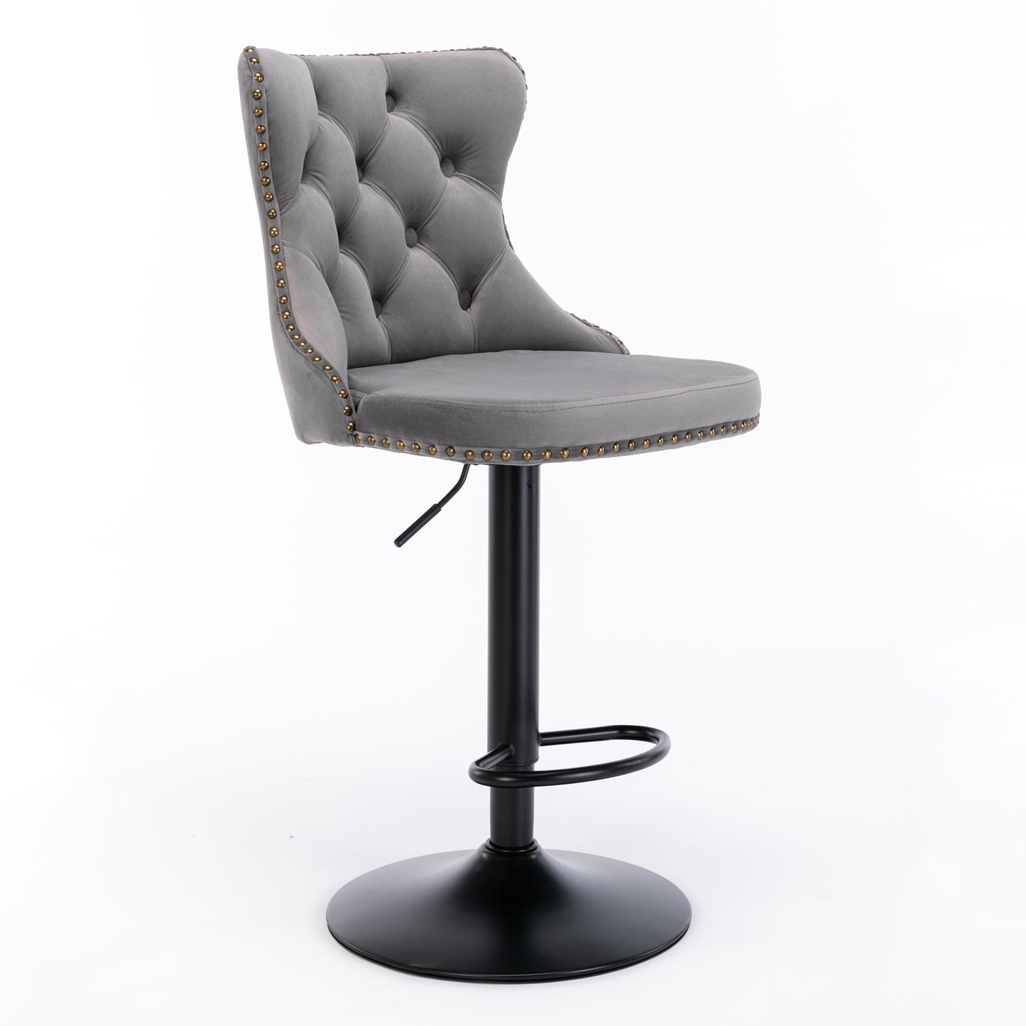 Tufted grey velvet bar stool with gold nailhead trim and adjustable black base