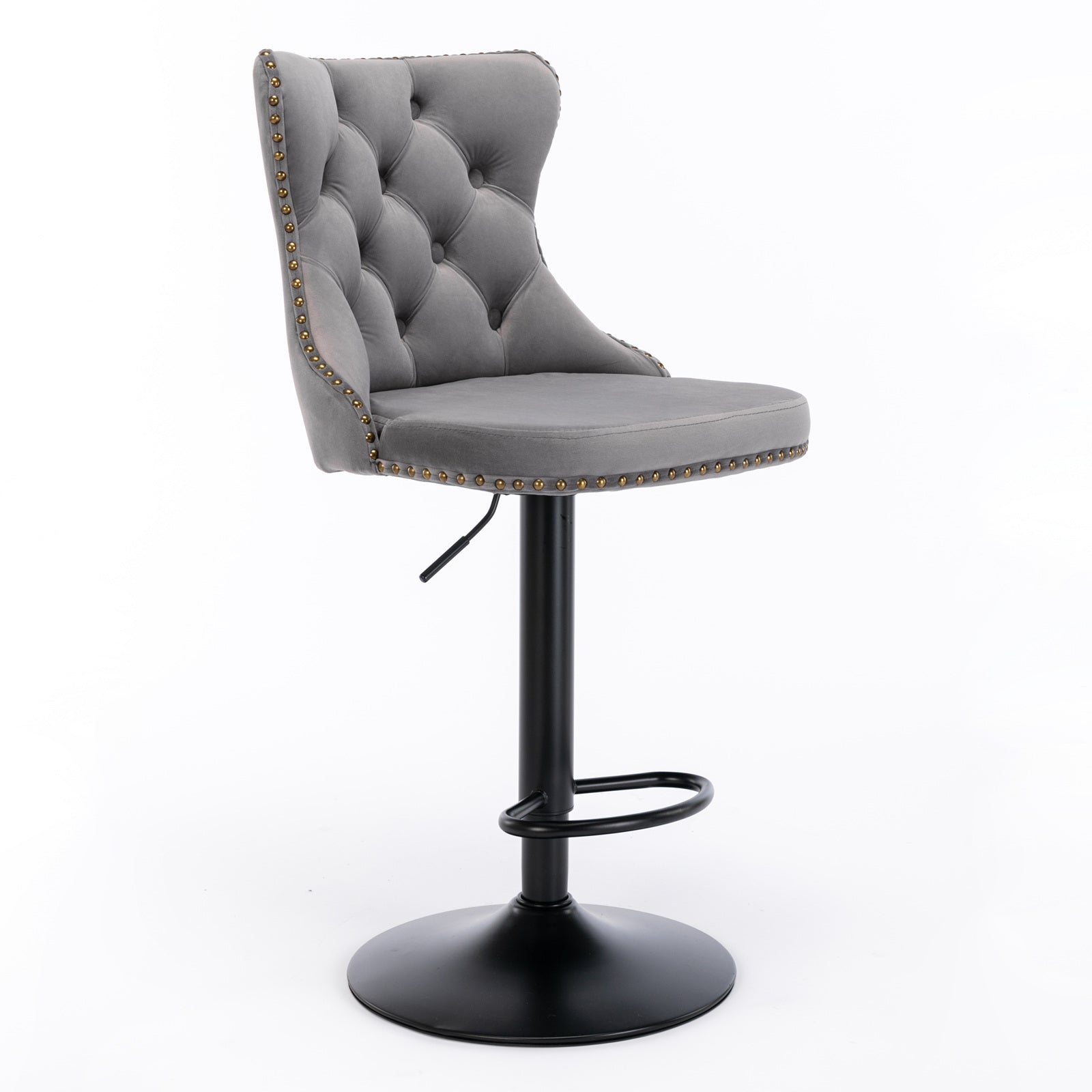 Tufted grey velvet bar stool with gold nailhead trim and adjustable black base