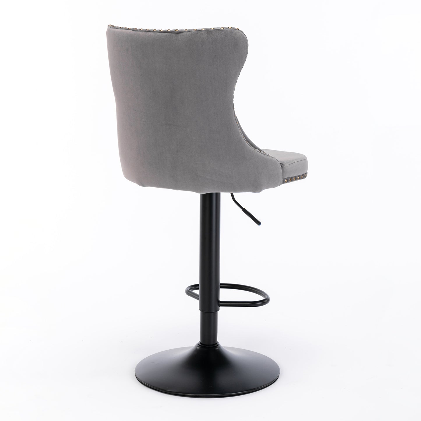 Gray velvet bar stool with tufted back and brass nailhead trim