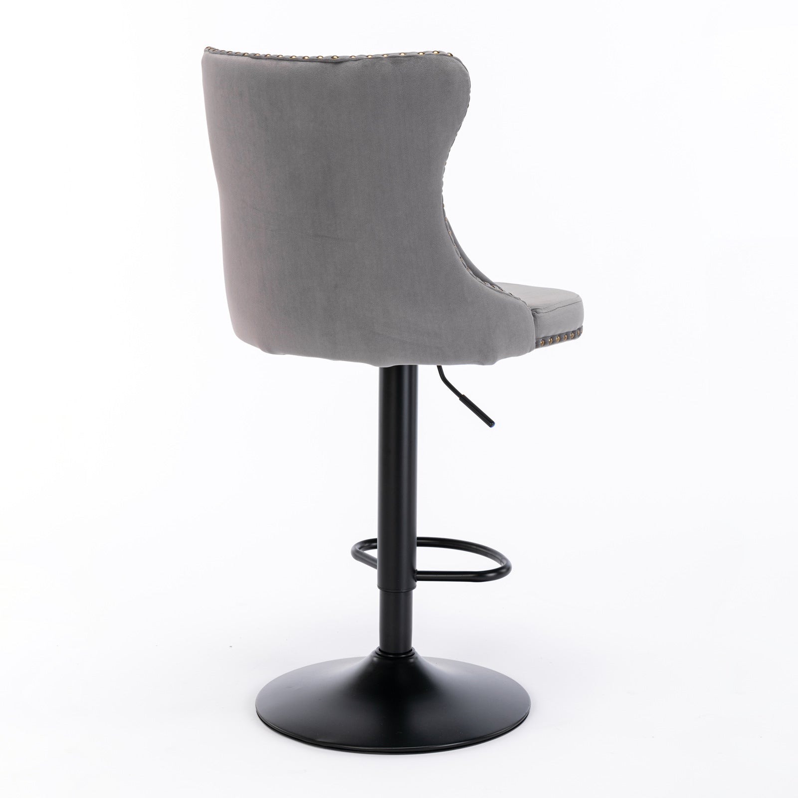 Gray velvet bar stool with tufted back and brass nailhead trim
