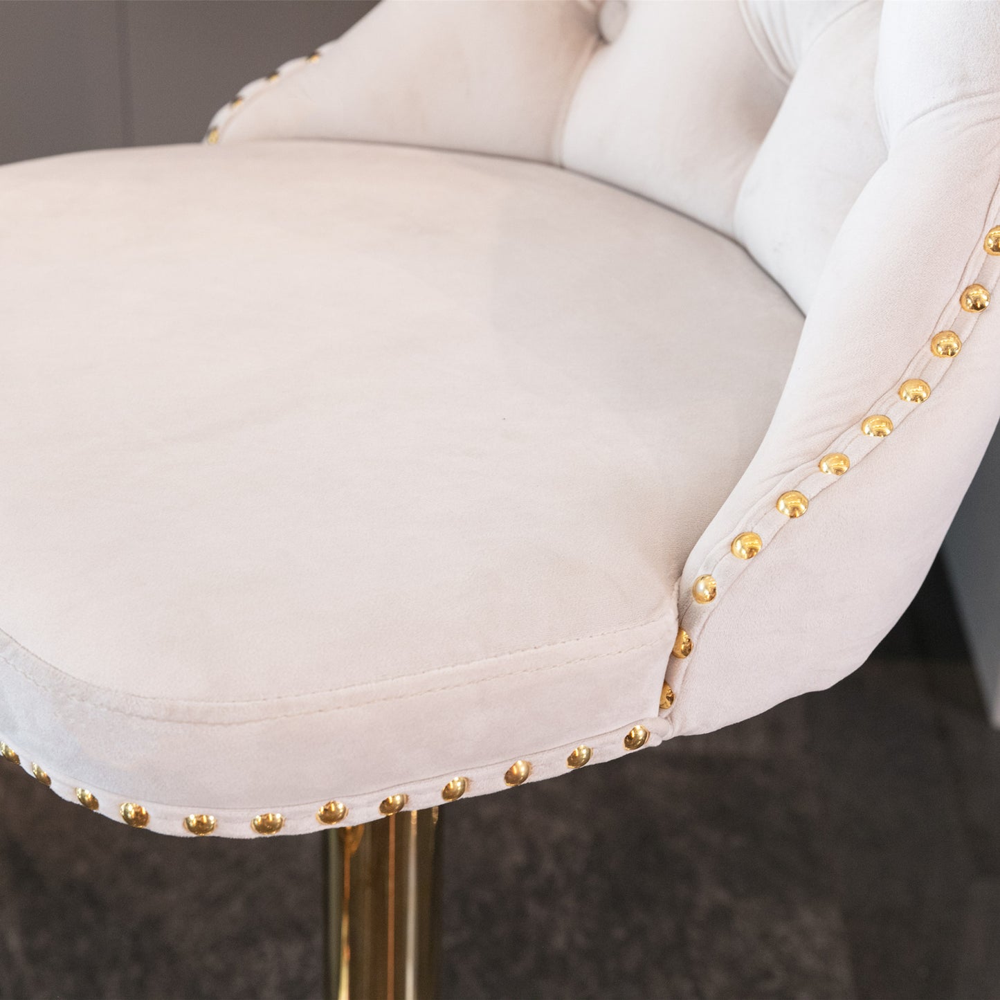 Cream velvet bar stool with gold nailhead trim