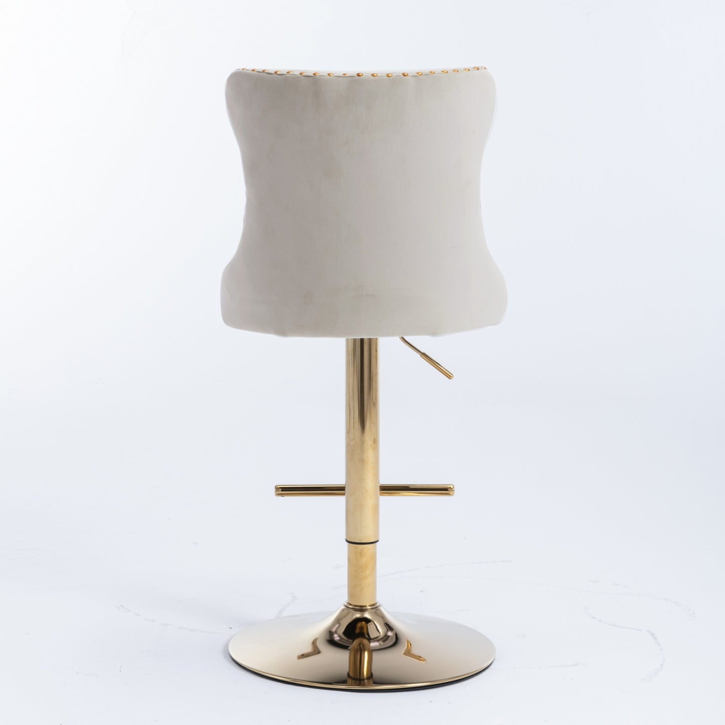 Cream upholstered bar stool with gold accents and a polished gold base