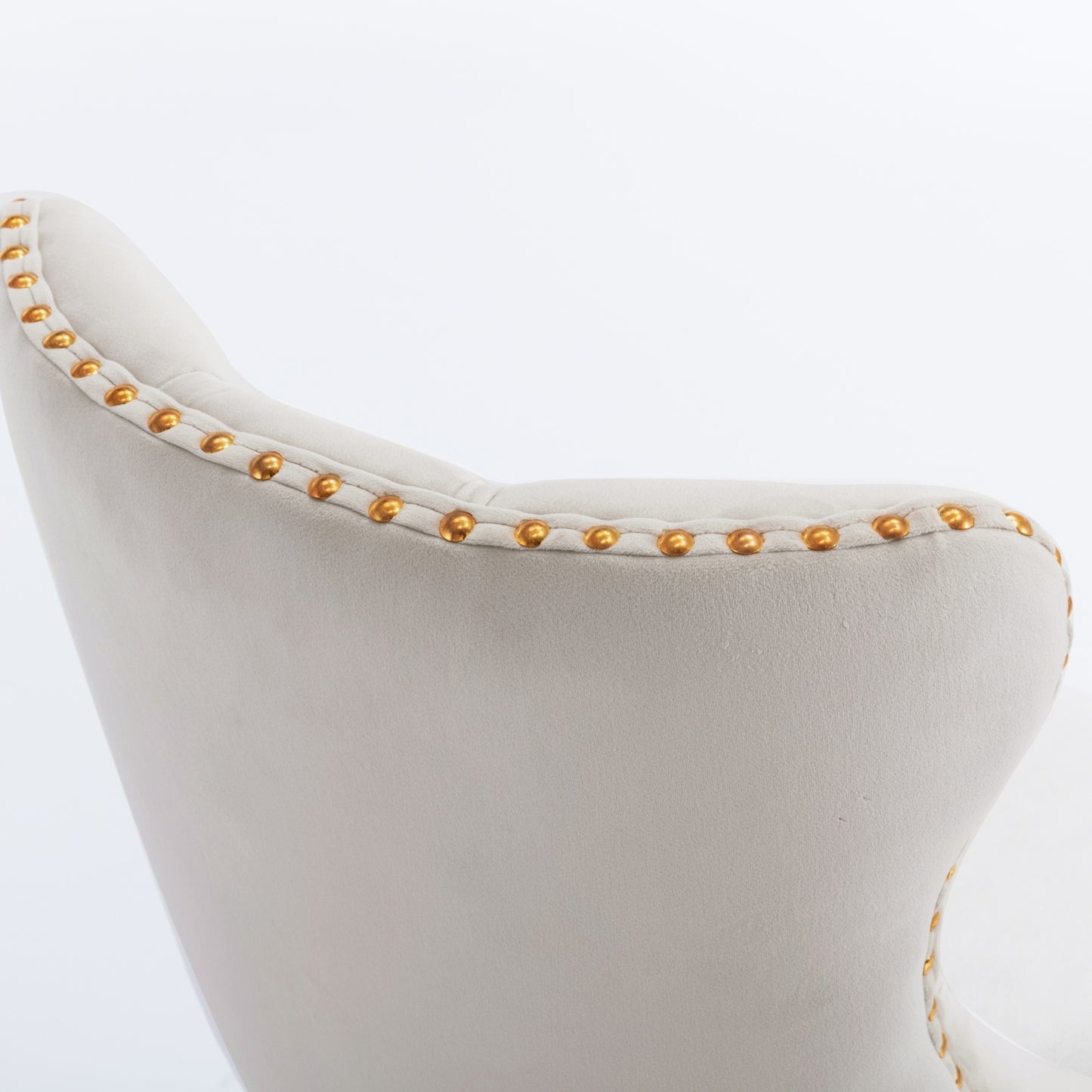Cream velvet accent chair with gold nailhead trim