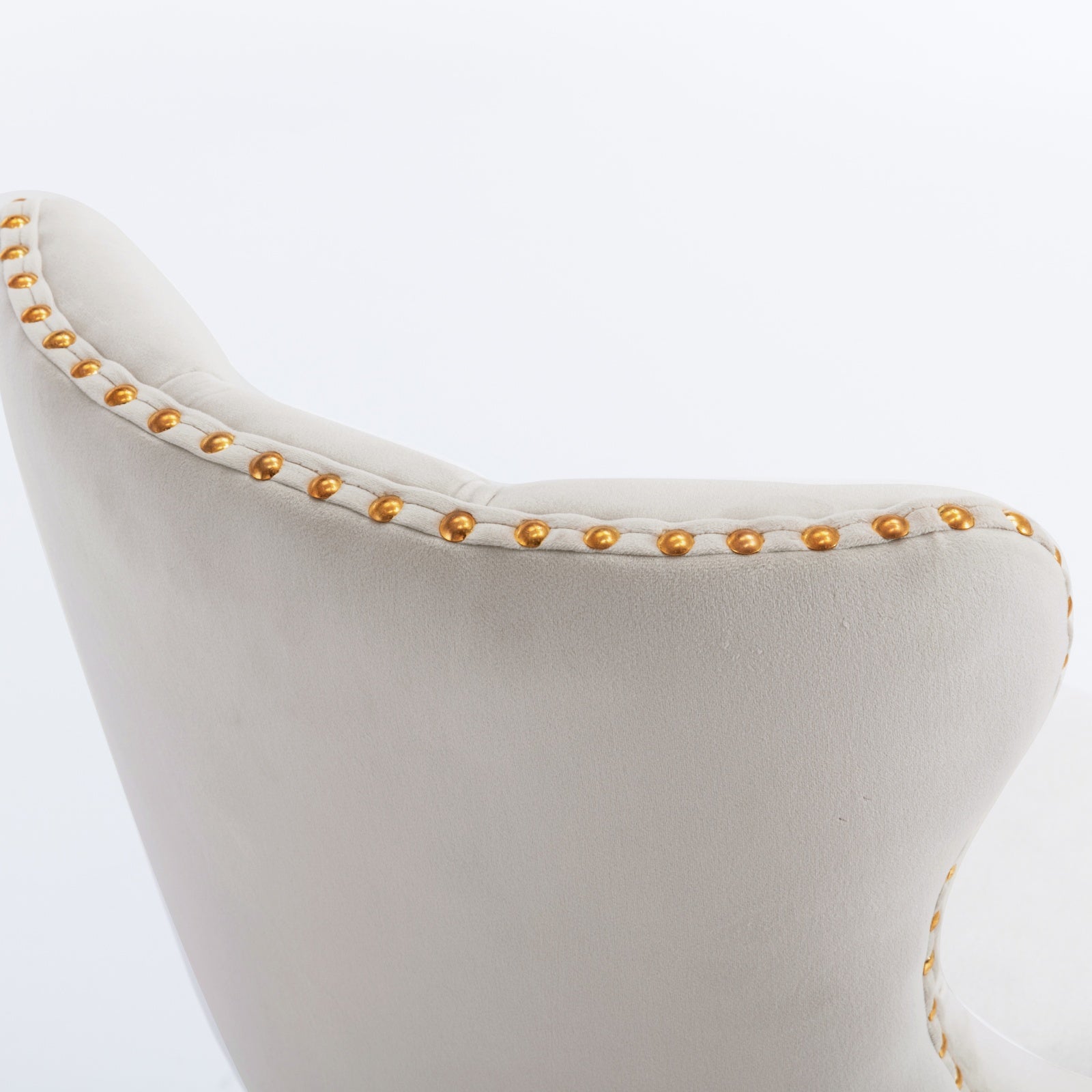 Cream velvet accent chair with gold nailhead trim