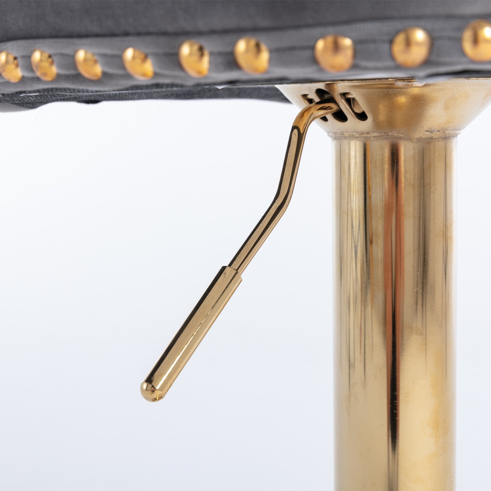 Adjustable bar stool lever with gold finish and decorative brass studs