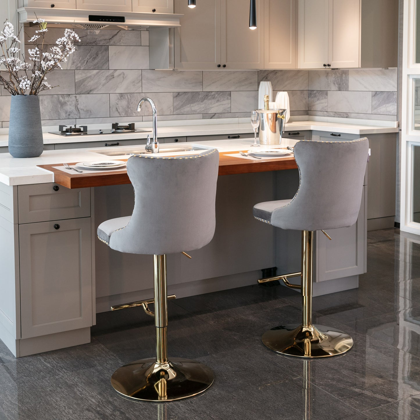Grey velvet bar stool with gold adjustable base and decorative trim