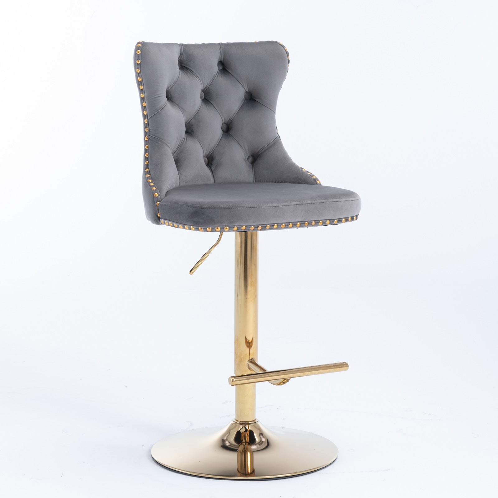 Tufted grey velvet bar stool with gold trim and a polished gold base