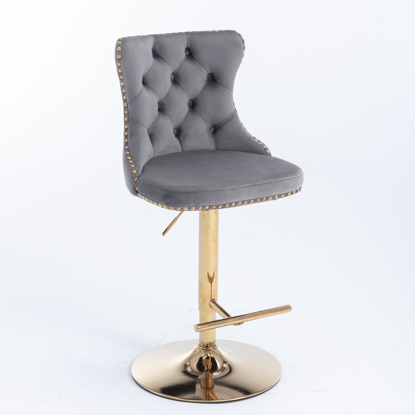 Grey velvet tufted bar stool with gold studded trim and adjustable gold pedestal base