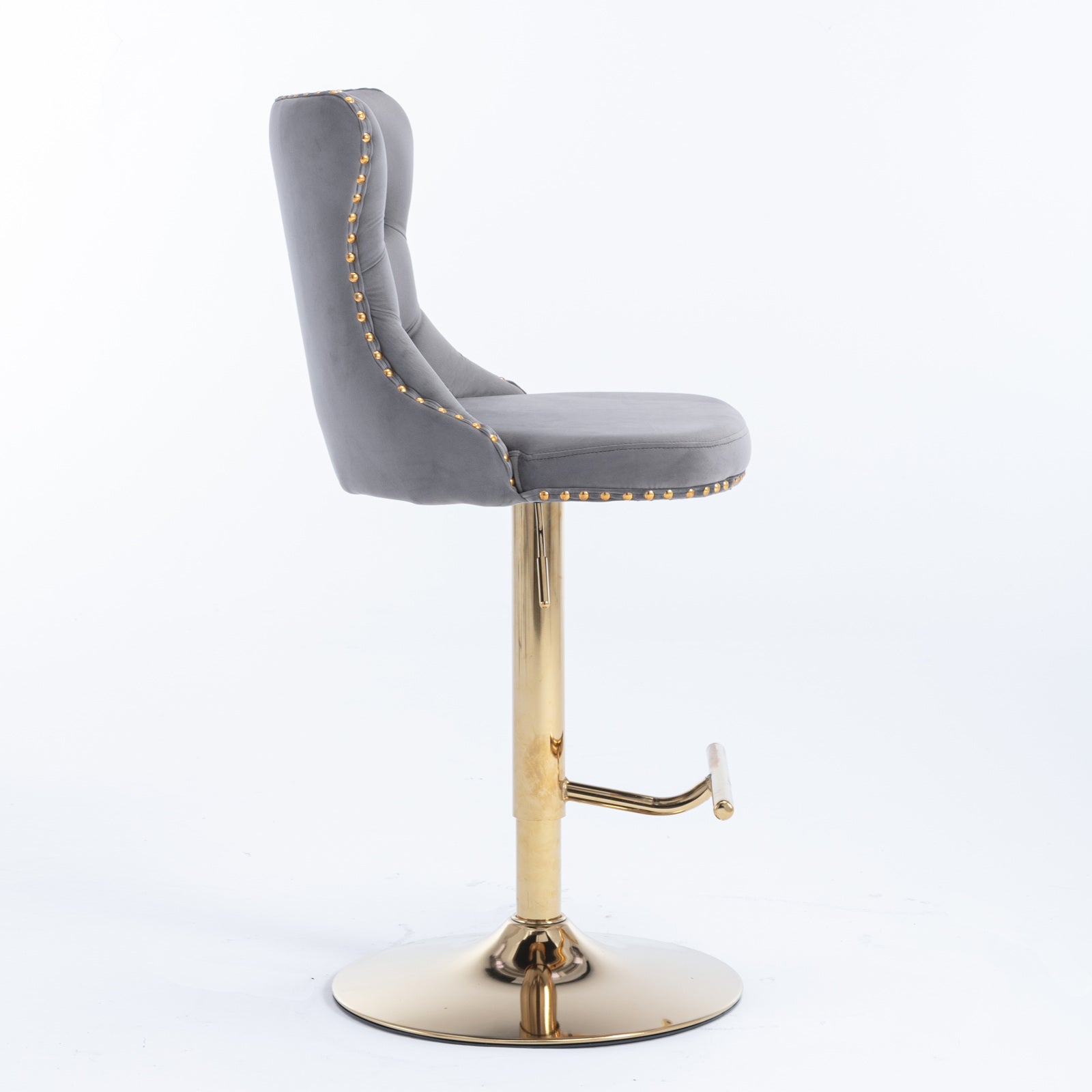 Grey velvet bar stool with gold stud accents and a gold adjustable pedestal base