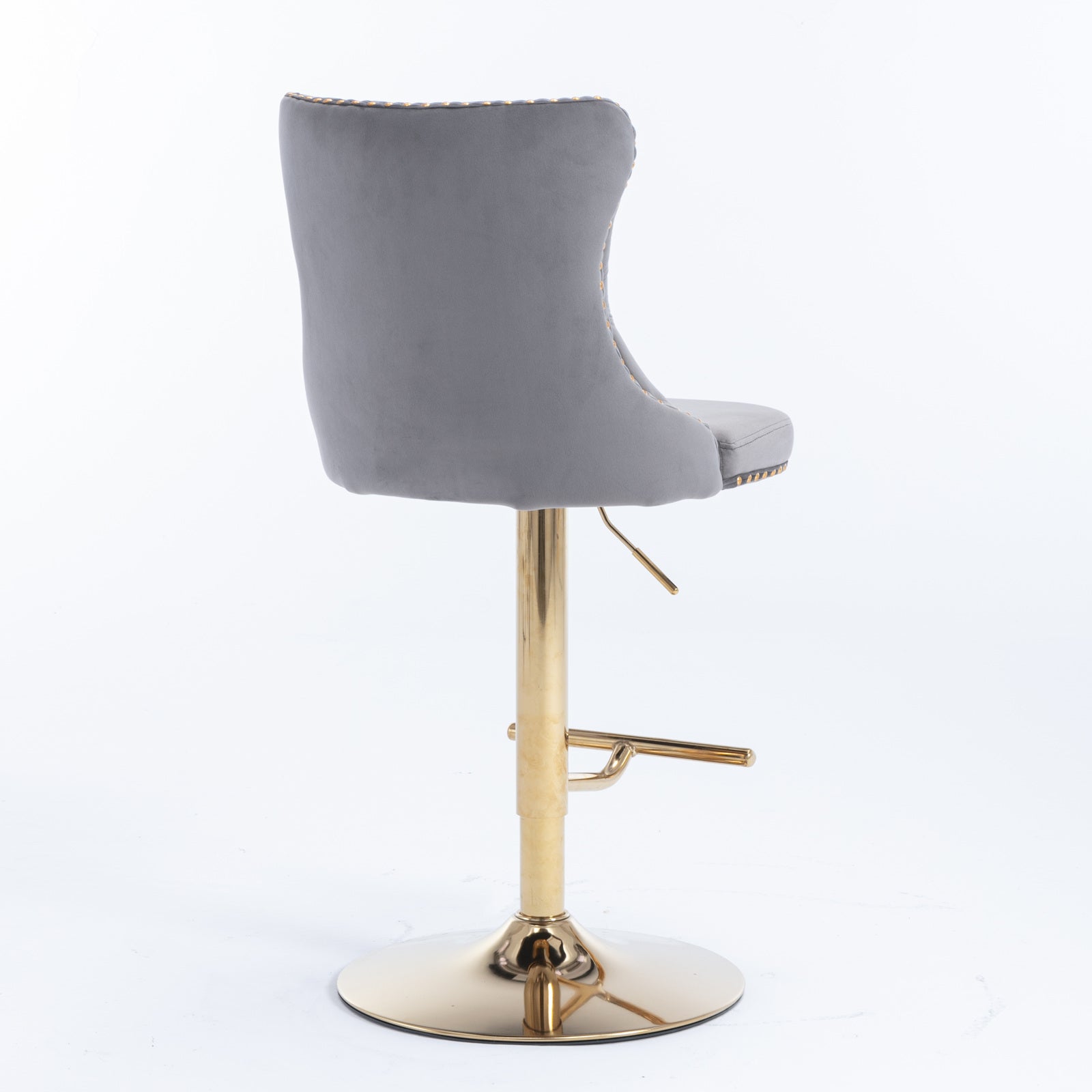 Grey velvet tufted bar stool with adjustable gold base and footrest
