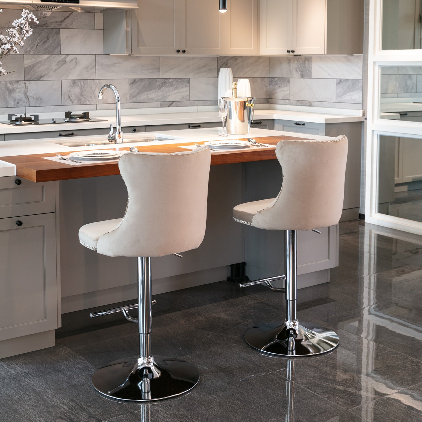 Beige velvet upholstered bar stool with chrome base and tufted back