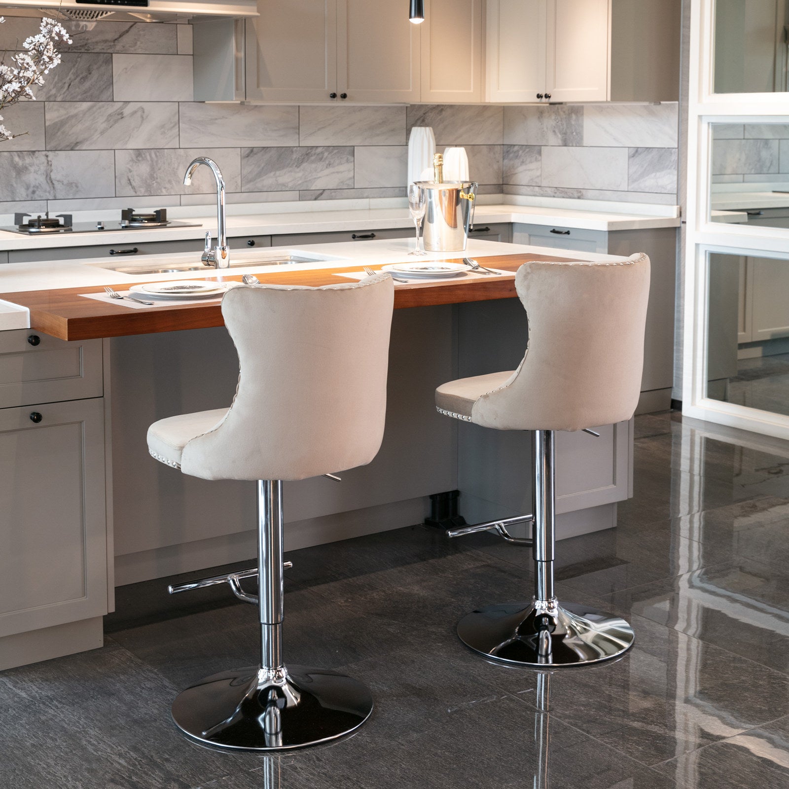 Beige velvet upholstered bar stool with chrome base and tufted back