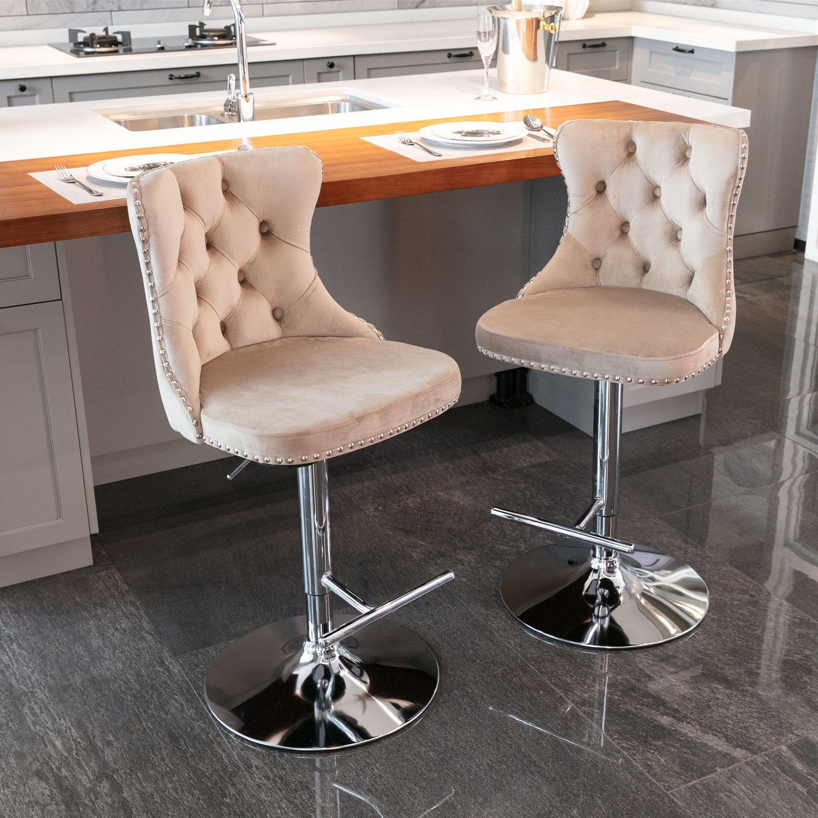 Beige velvet tufted bar stool with silver nailhead trim and chrome base