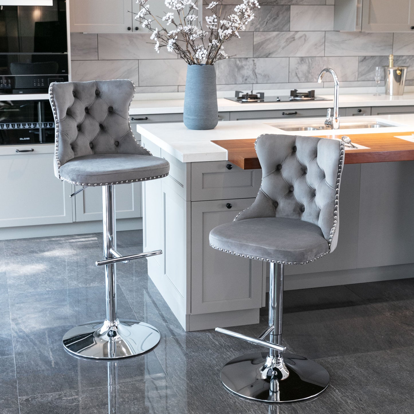Grey velvet tufted bar stool with silver nailhead trim