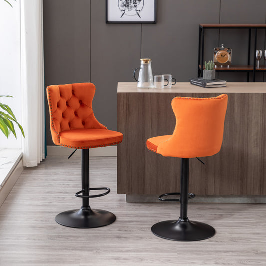Orange velvet bar stool with tufted back and brass nailhead trim