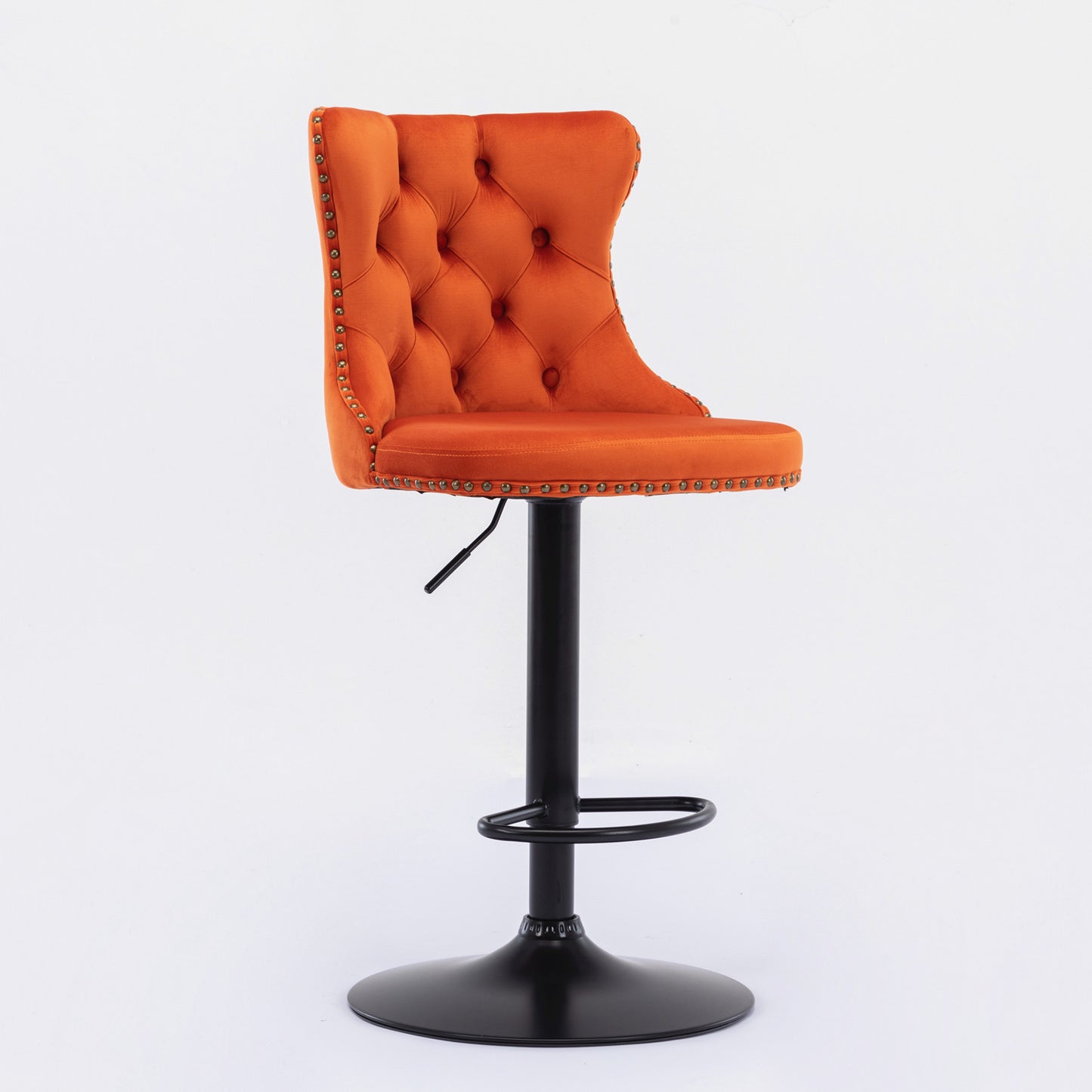 Orange velvet tufted bar stool with antique brass nailhead trim and adjustable height