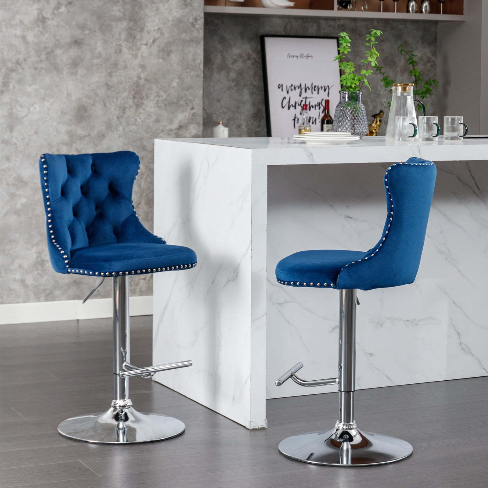 Blue velvet tufted bar stool with silver nailhead trim and chrome base