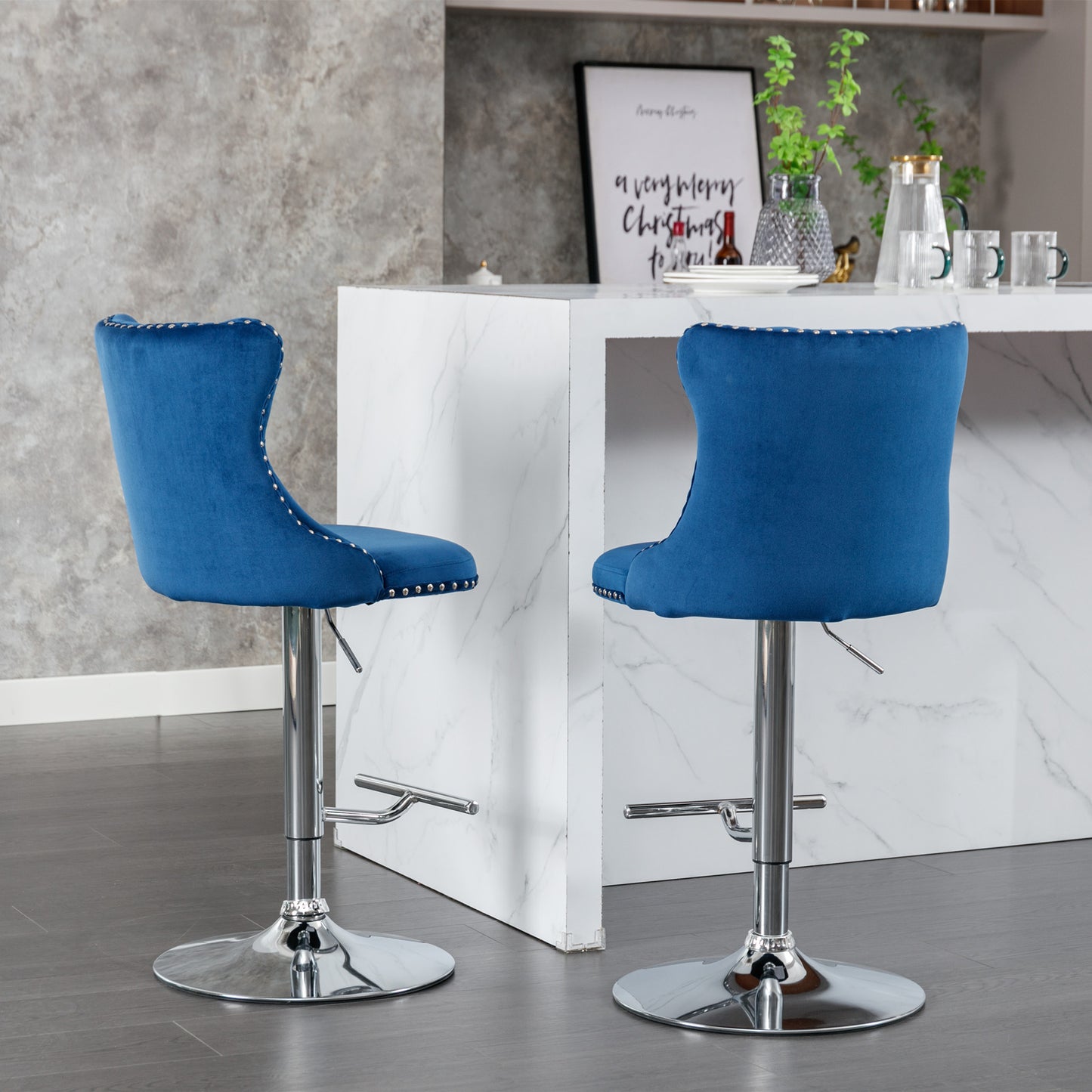 Adjustable blue velvet bar stool with chrome base and silver nailhead trim