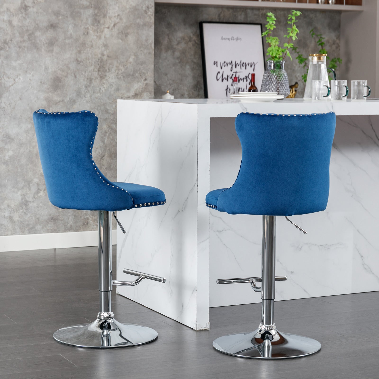 Adjustable blue velvet bar stool with chrome base and silver nailhead trim