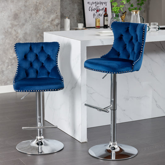 Blue velvet tufted bar stool with silver nailhead trim and chrome base